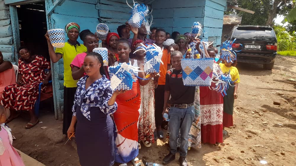 Community members displaying handmade products from ROSAM empowerment program